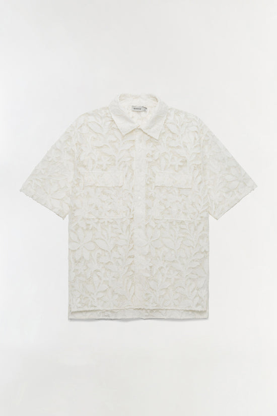 White cotton lace short-sleeve shirt with leaf pattern and pointed collar.