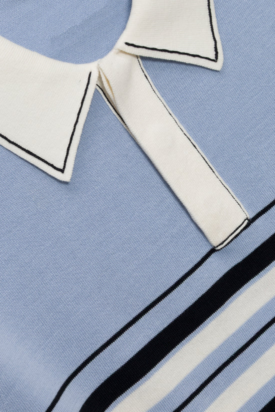 Light blue cotton knit popover with white collar and black striped trim detail.