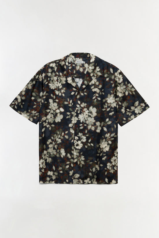 Navy short-sleeve shirt with cream, white, and rust floral print throughout.