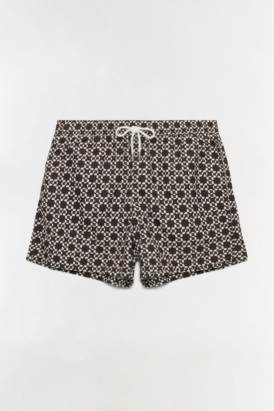 Black and white checkered swim shorts with drawstring waist and scalloped hem.