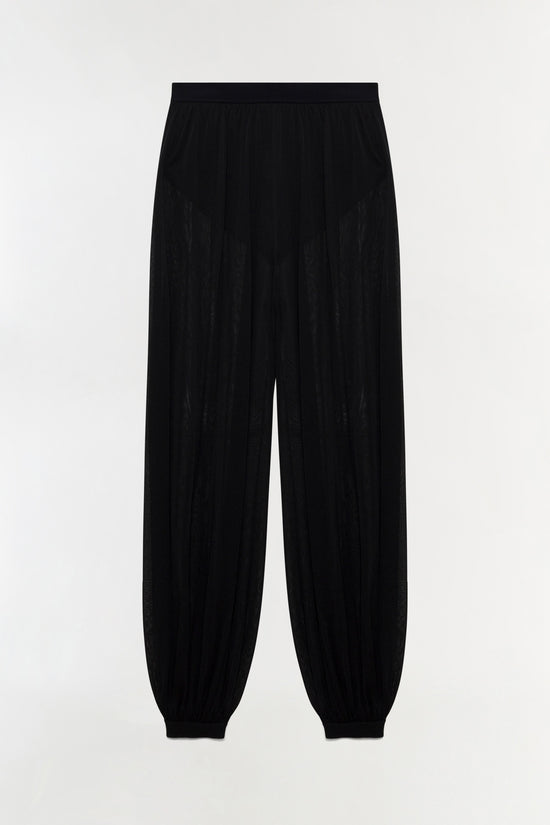 Black sheer knit pant with elastic waistband and tapered ankles.