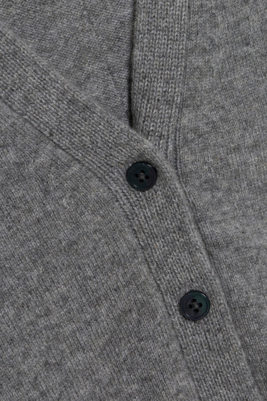 Gray cashmere cardigan with ribbed knit sleeves and black buttons.