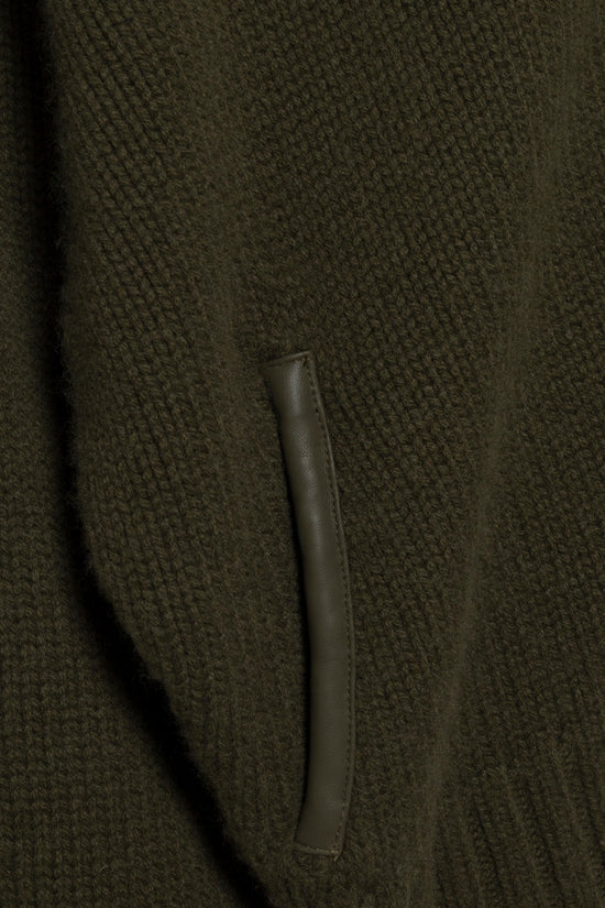 Olive-green knit cardigan with textured fabric and front pocket detail.