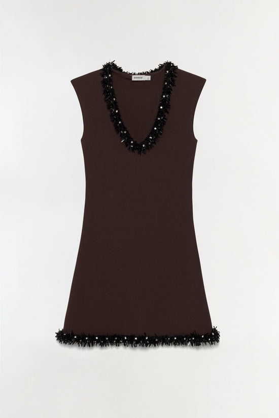 Brown sleeveless knit mini dress with black beaded fringe trim on neckline and hem.