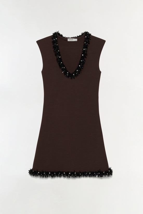 Brown sleeveless knit mini dress with black beaded fringe trim on neckline and hem.