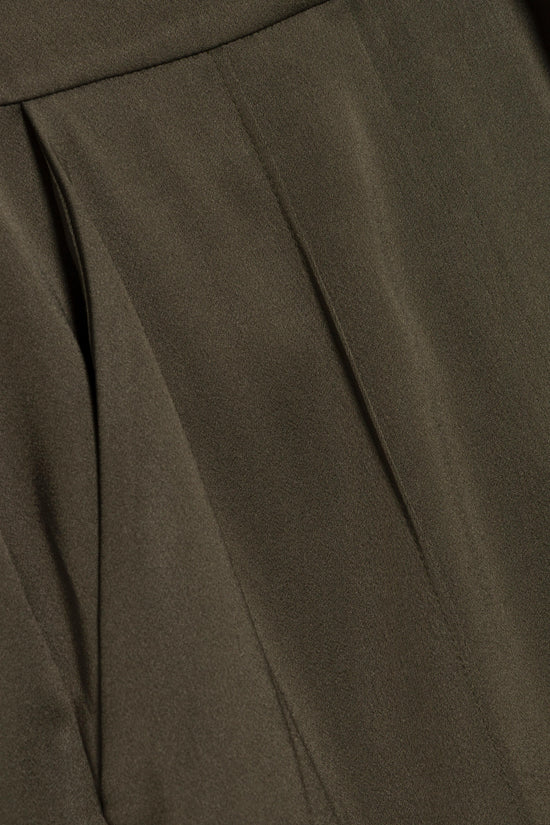 Olive green satin pant with draped pleats and smooth fabric texture.