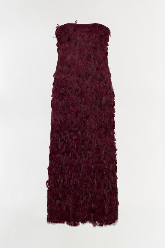 Sleeveless burgundy gown with feather detailing throughout, floor-length silhouette with strapless neckline.