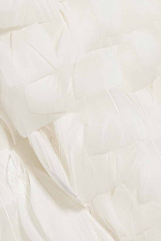 Cream-colored feathered fabric with layered feathers creating textured, flowing panels.