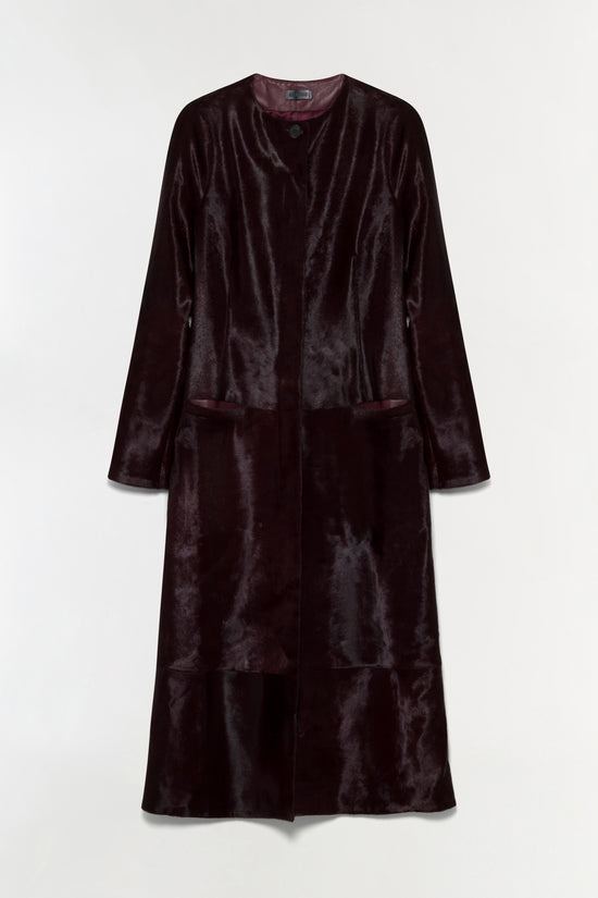 Dark burgundy calf hair coat with collarless neckline, long sleeves, and tiered hemline.