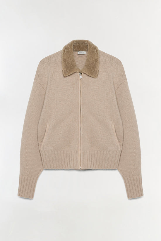 Beige wool cardigan with textured collar, front zip closure, and ribbed cuffs.