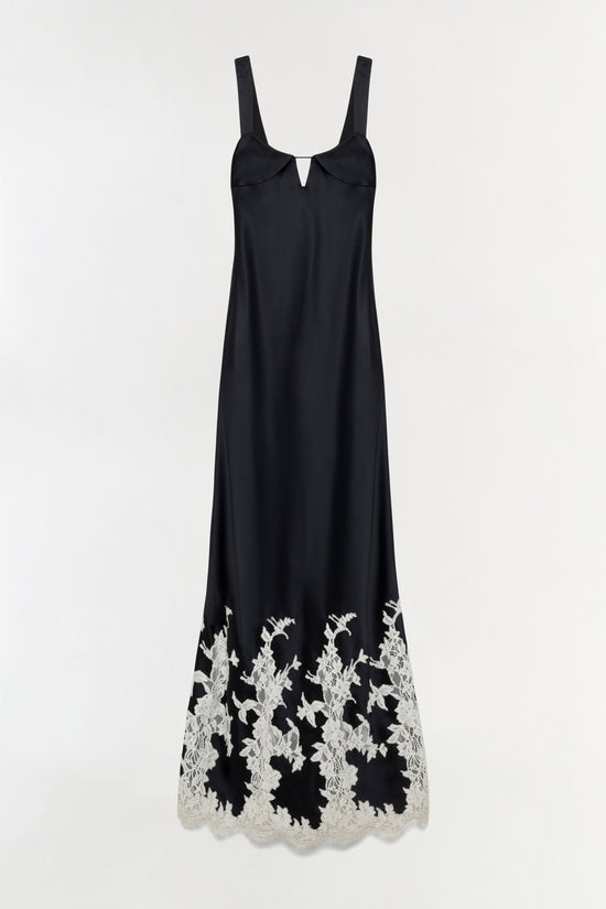 Black sleeveless gown with wide straps, V-neckline, and white lace floral trim along the hem.