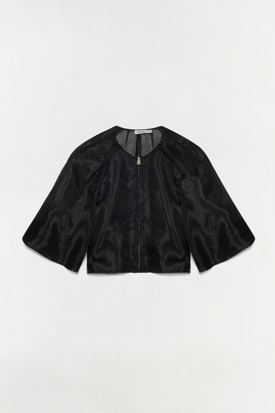 Black organza top with short bell sleeves, front zip closure, and sheer fabric with knit trim at neckline.