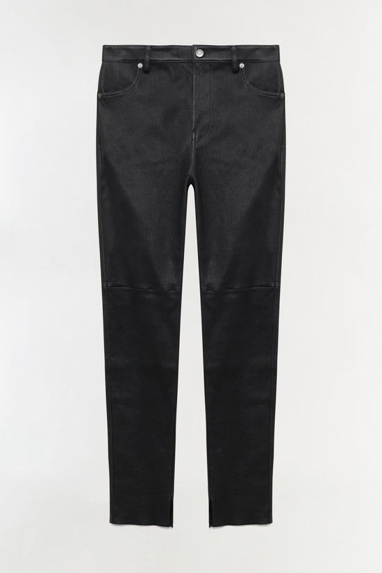 Black leather high-rise skinny pants with contrasting denim upper section and visible seaming at knee.