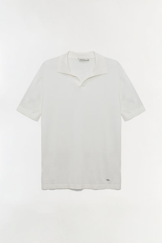 White polo shirt with short sleeves, collared neckline, and small logo detail on lower front.