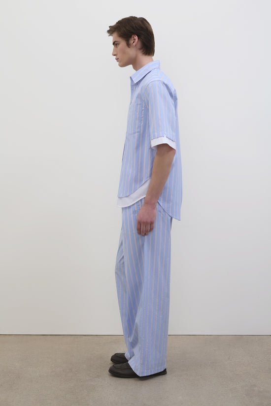 Light blue striped cotton shirt with short sleeves and white contrasting collar worn by male model.