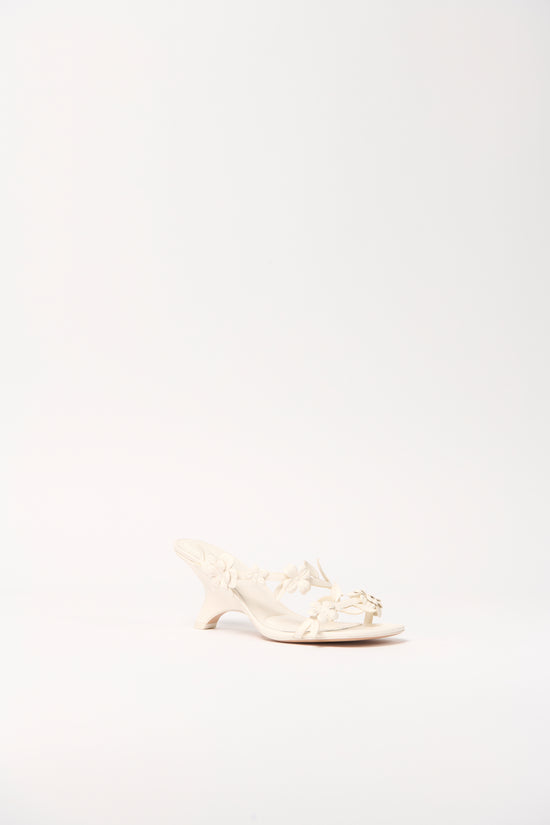 Cream leather strappy sandal with gathered detail across the foot and a low curved heel, shown in profile view.
