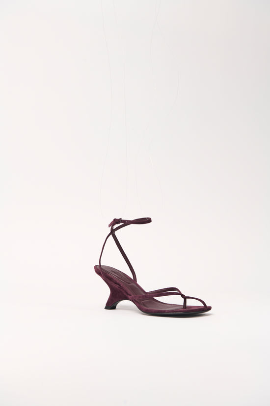 Burgundy suede strappy wedge sandal with thin ankle strap and curved wedge heel.