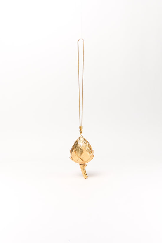 Gold-toned artichoke-shaped clutch with long chain strap and leaf detail at base.