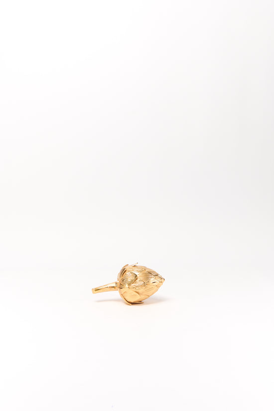 Gold-toned artichoke-shaped clutch with textured surface and handle against white background.