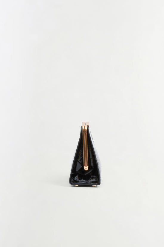Black leather clutch with croc-embossed texture, gold zip closure, and nude top handle.