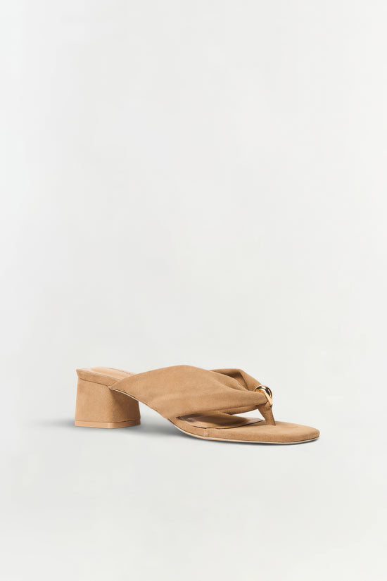 Tan suede thong sandal with a chunky block heel and knotted toe strap.