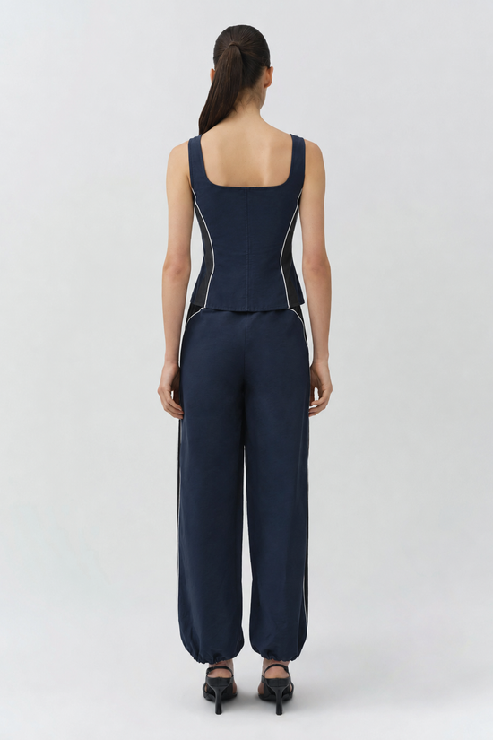 Navy cotton faille bustier top with square neckline and white side piping, shown from back.