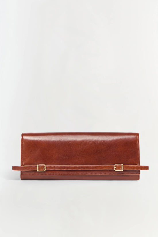 Brown leather clutch with adjustable shoulder strap and gold-tone buckle closures.