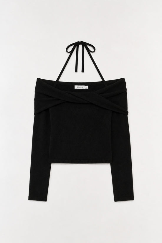 Black off-shoulder knit top with crossed fabric detail and black neck ties.