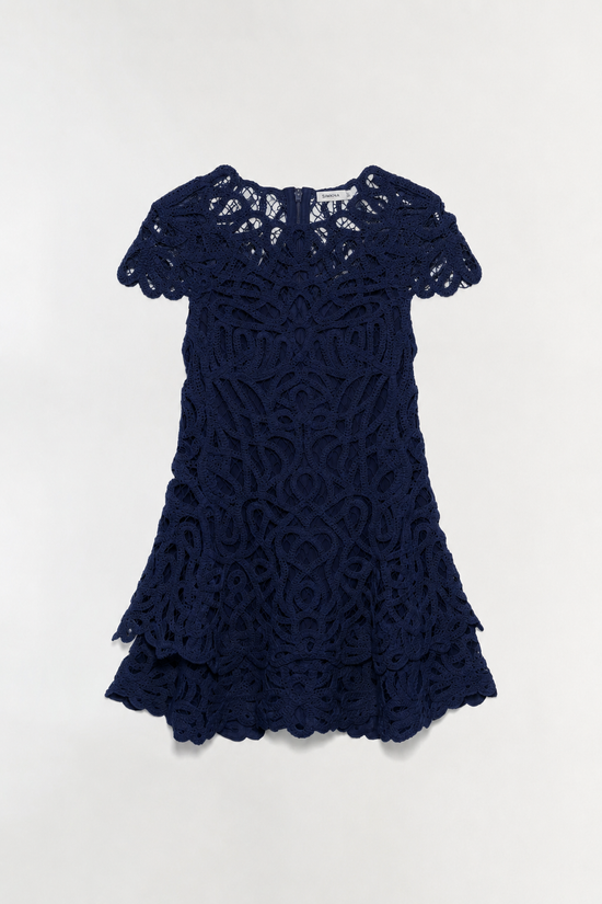 Navy lace mini dress with short puffed sleeves and tiered layered skirt with scalloped edges.