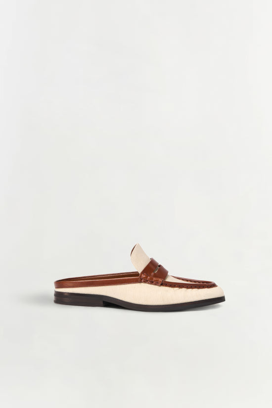 Cream canvas and brown leather loafer mule with black sole, shown in side profile.