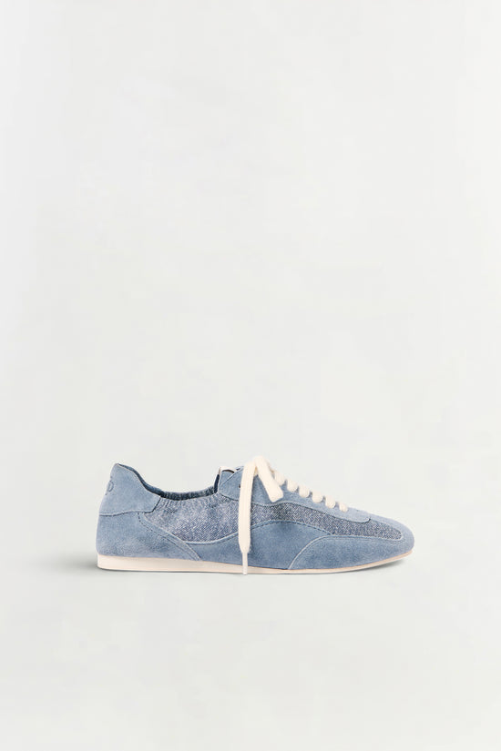 Blue denim and leather sneaker with cream laces and sole, shown in profile view.