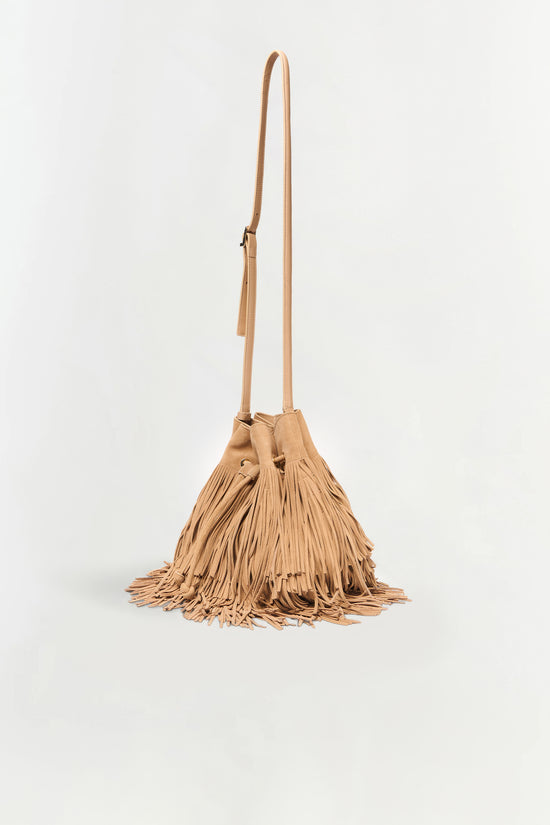 Tan suede crossbody bag with long fringe trim covering the body and a long shoulder strap.
