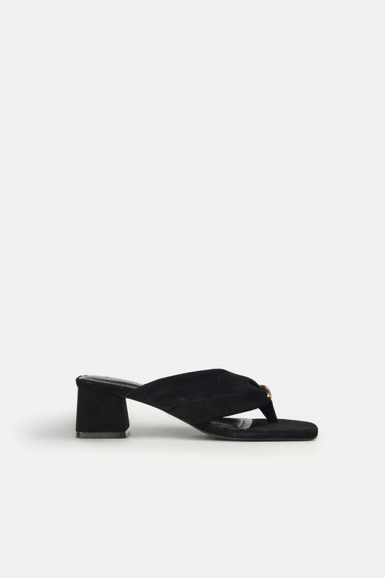 Black suede thong sandal with a chunky block heel and metallic accent on the toe strap.