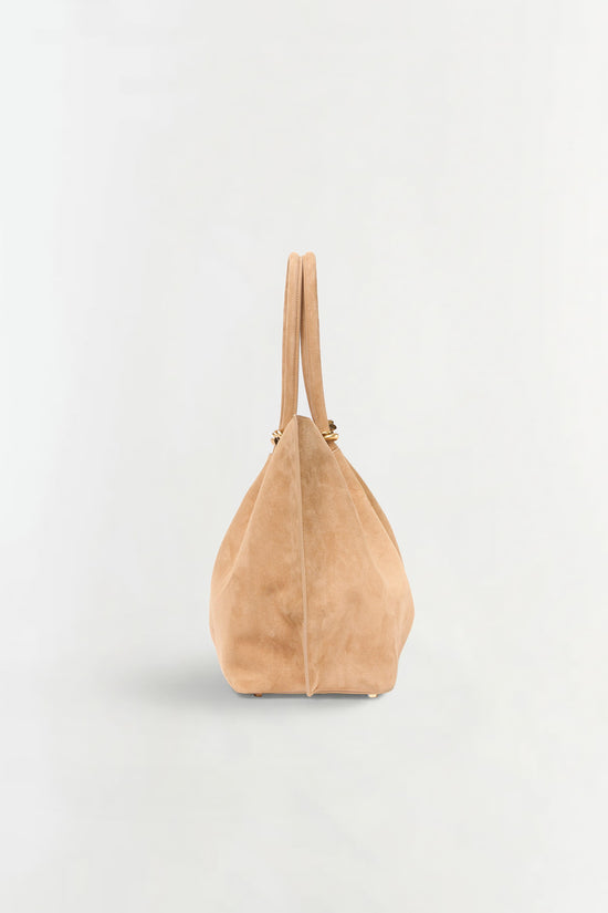 Beige suede tote bag with dual handles and center seam detail, shown from front view.