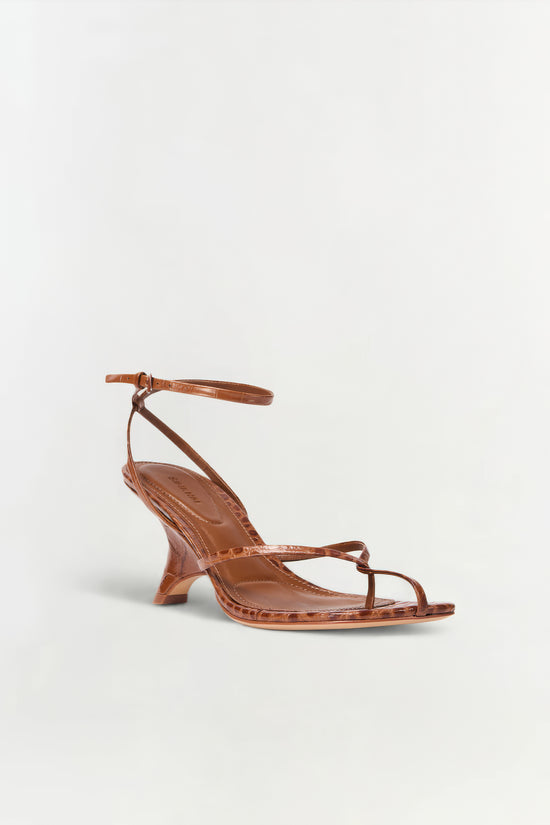 Cognac leather strappy wedge sandal with ankle strap and crocodile embossed texture.