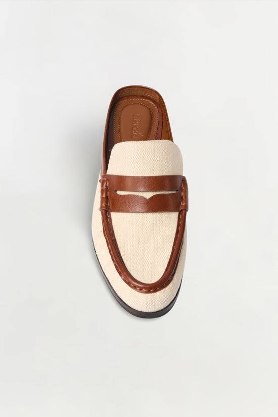 Brown leather and cream canvas loafer mule with dark sole, shown from above.