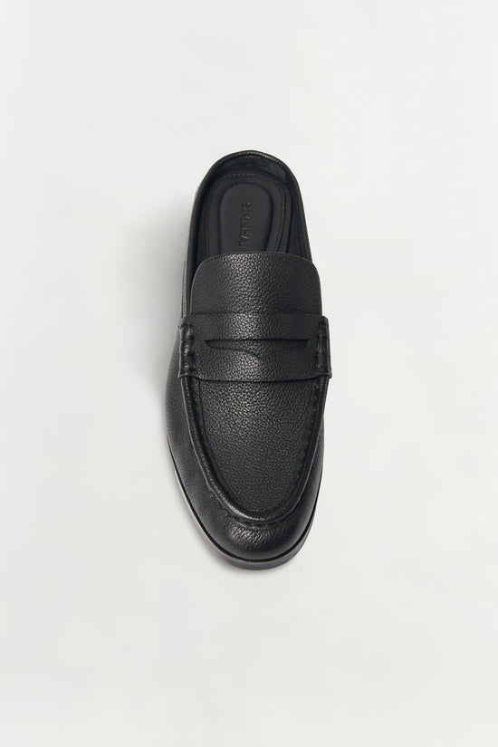 Black pebbled leather loafer mule with textured surface and dark sole, shown from above.