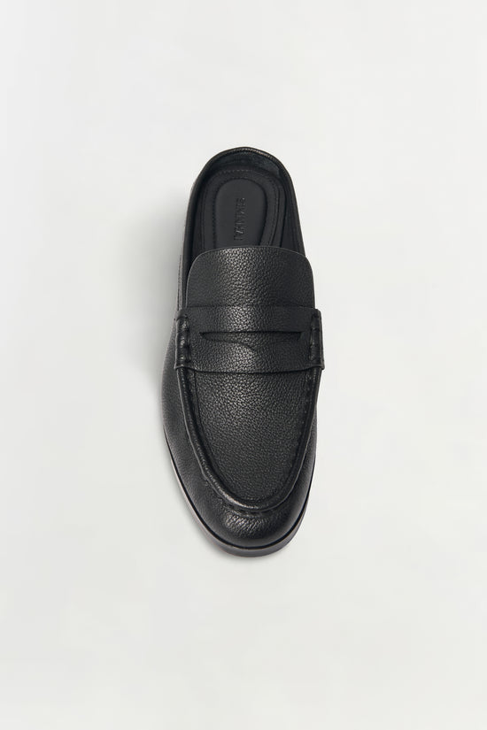Black pebbled leather loafer mule with textured surface and dark sole, shown from above.