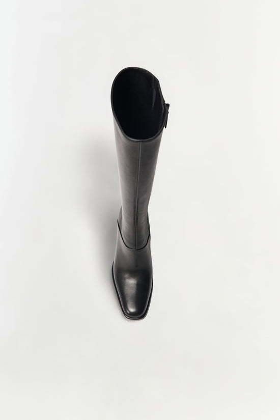 Black leather knee-high boot with a square toe and side zipper, shown from above.