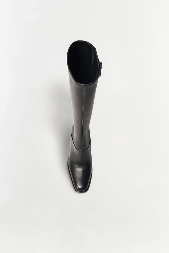 Black leather knee-high boot with a square toe and side zipper, shown from above.