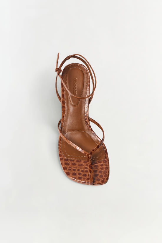 Brown leather strappy wedge sandal with croc-embossed toe box and ankle tie closure, shown from above.