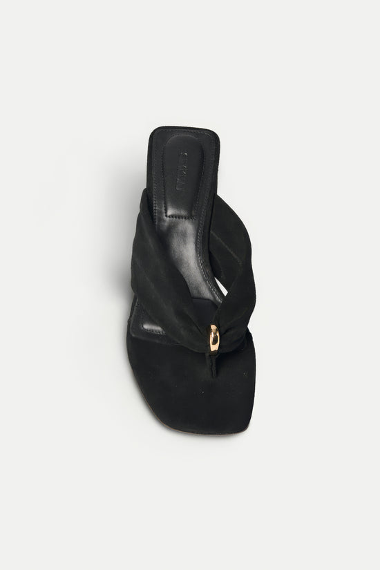 Black suede thong sandal with block heel and gold-tone hardware, shown from above.